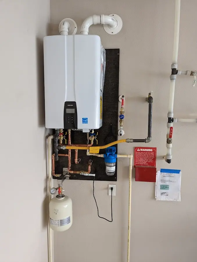 Professional plumber installing copper piping in a Avocado Heights home